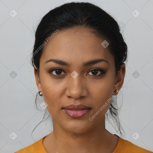 Joyful latino young-adult female with short  black hair and brown eyes