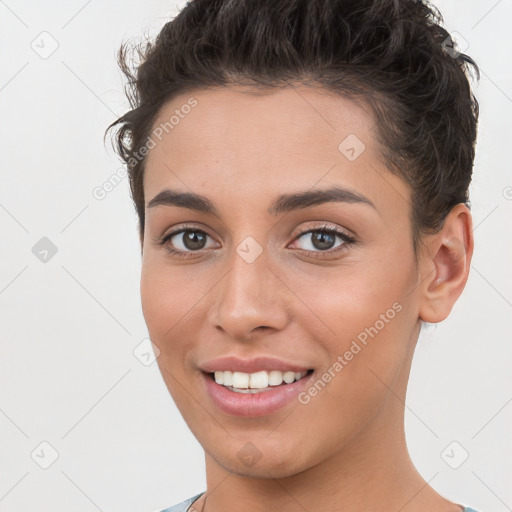 Joyful white young-adult female with short  brown hair and brown eyes