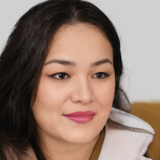 Joyful asian young-adult female with medium  brown hair and brown eyes
