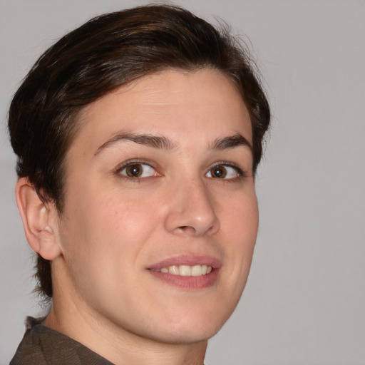 Joyful white young-adult female with short  brown hair and brown eyes