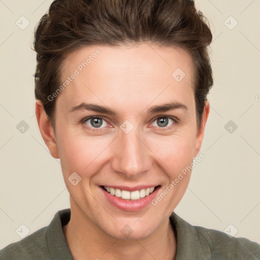 Joyful white young-adult female with short  brown hair and grey eyes