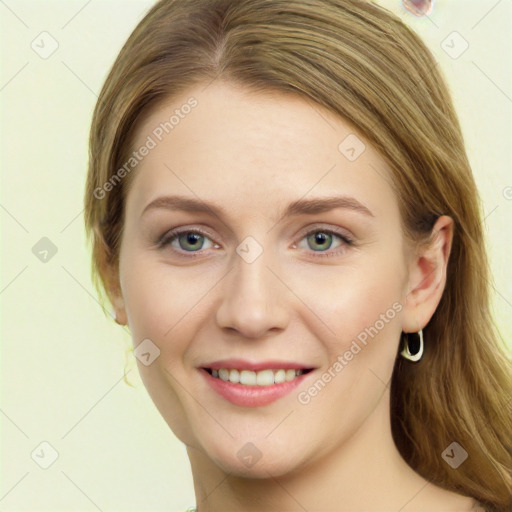 Joyful white young-adult female with long  brown hair and green eyes