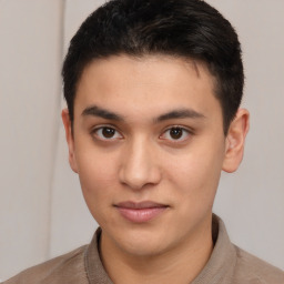 Joyful latino young-adult male with short  brown hair and brown eyes