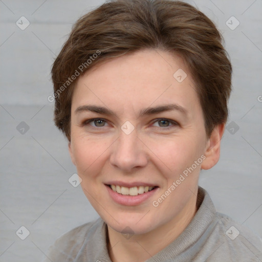 Joyful white young-adult female with short  brown hair and grey eyes