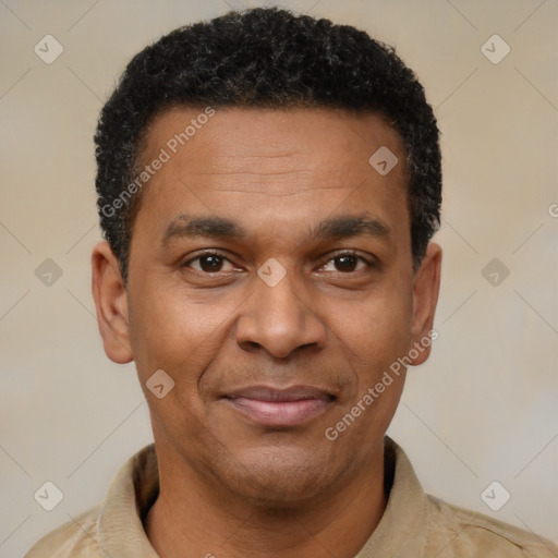 Joyful latino adult male with short  brown hair and brown eyes