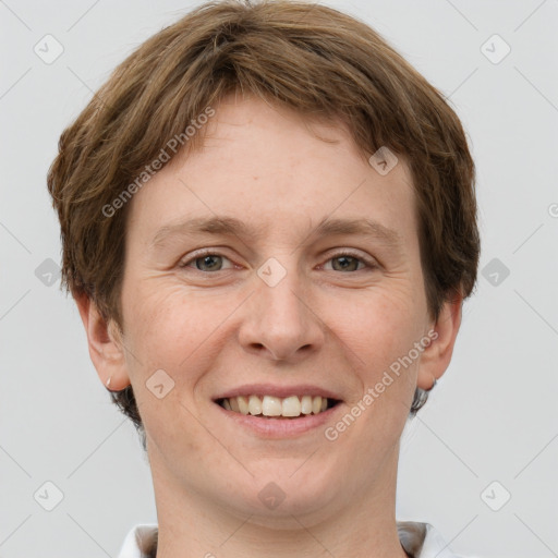 Joyful white adult male with short  brown hair and grey eyes