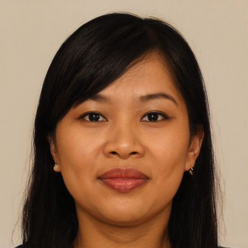 Joyful asian young-adult female with long  brown hair and brown eyes