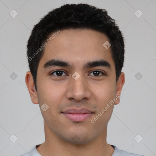 Joyful white young-adult male with short  black hair and brown eyes