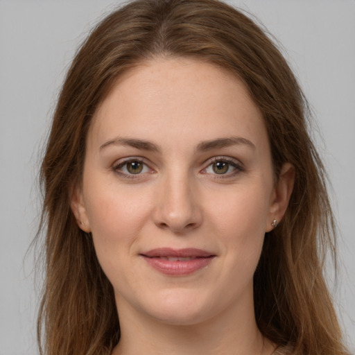 Joyful white young-adult female with long  brown hair and grey eyes