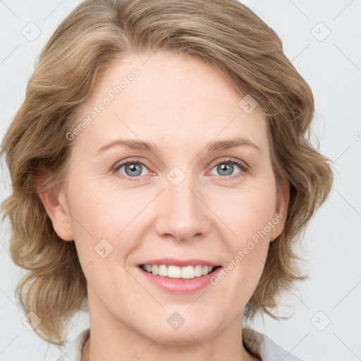 Joyful white young-adult female with medium  brown hair and blue eyes