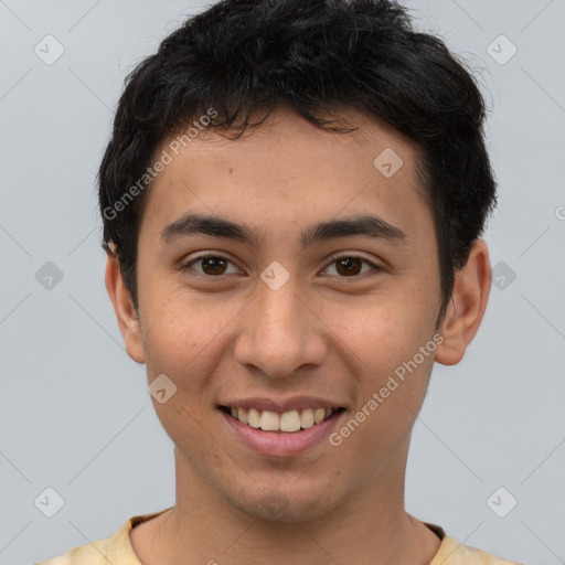 Joyful latino young-adult male with short  brown hair and brown eyes