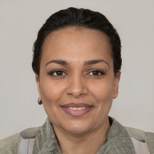 Joyful white adult female with short  brown hair and brown eyes