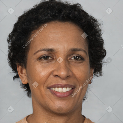 Joyful black adult female with short  brown hair and brown eyes