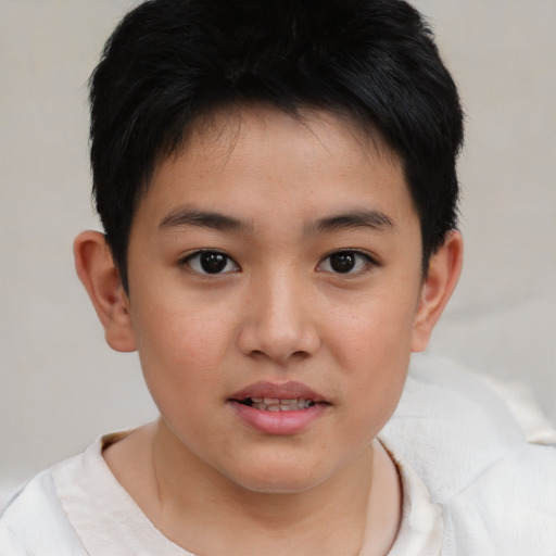 Joyful white child male with short  brown hair and brown eyes