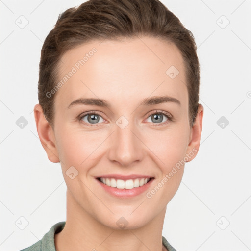 Joyful white young-adult female with short  brown hair and grey eyes