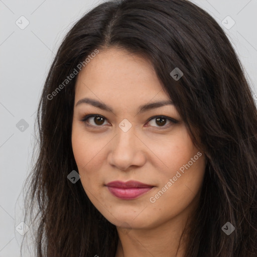 Joyful latino young-adult female with long  brown hair and brown eyes