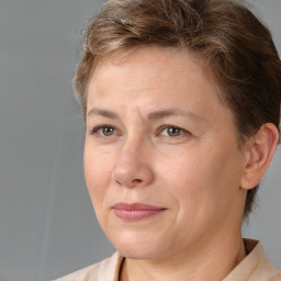 Joyful white adult female with short  brown hair and brown eyes