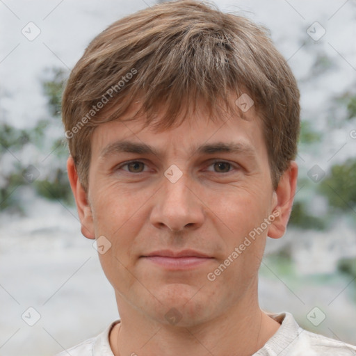 Joyful white adult male with short  brown hair and brown eyes