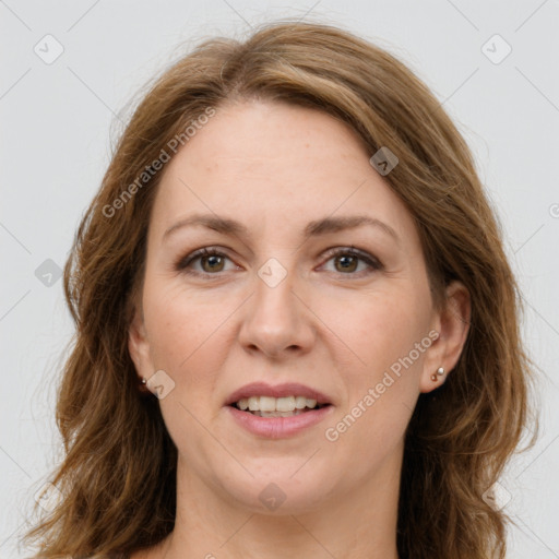 Joyful white adult female with long  brown hair and green eyes