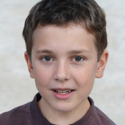 Joyful white child male with short  brown hair and brown eyes