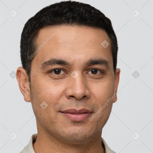 Joyful white young-adult male with short  black hair and brown eyes