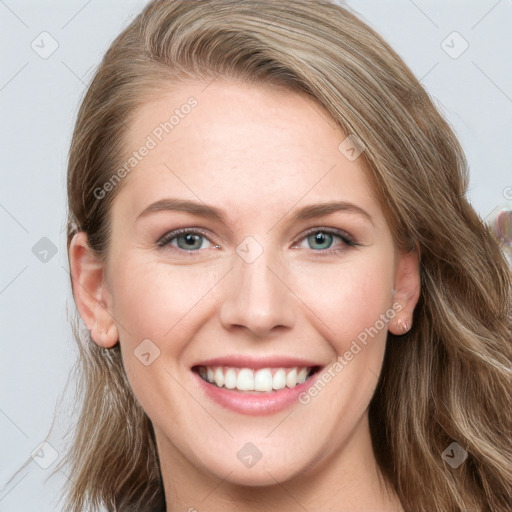 Joyful white young-adult female with long  brown hair and blue eyes