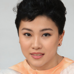 Joyful asian young-adult female with short  black hair and brown eyes