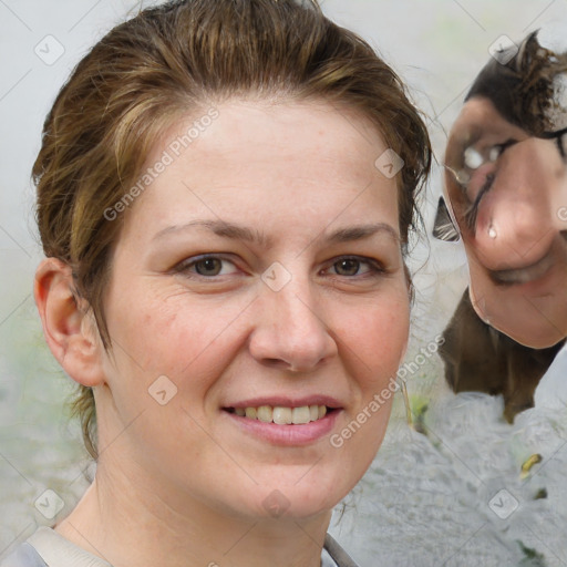 Joyful white adult female with medium  brown hair and brown eyes