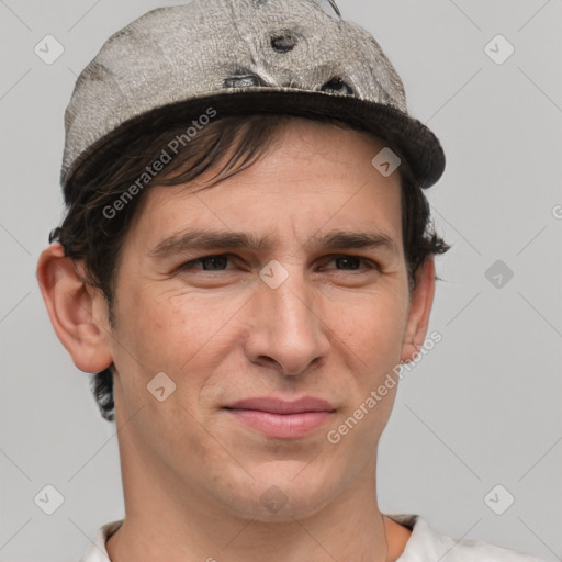 Joyful white adult male with short  brown hair and grey eyes