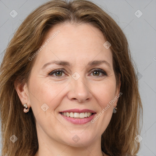 Joyful white adult female with medium  brown hair and brown eyes