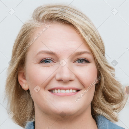 Joyful white young-adult female with long  brown hair and blue eyes