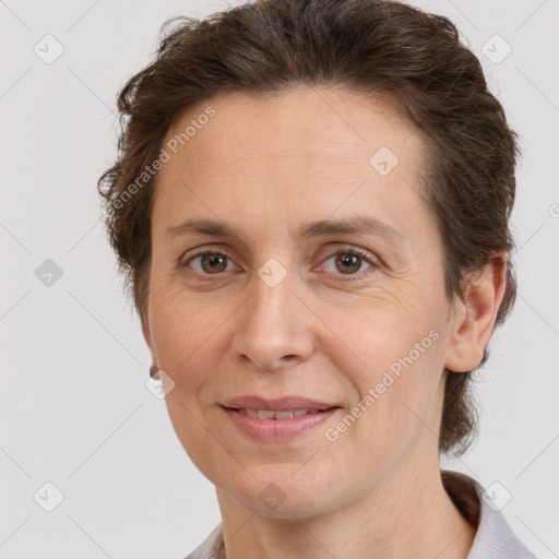 Joyful white adult female with short  brown hair and brown eyes