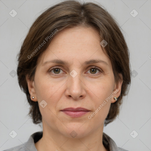 Joyful white adult female with medium  brown hair and grey eyes