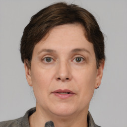 Joyful white adult female with short  brown hair and brown eyes