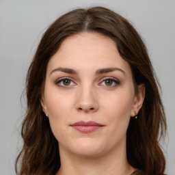 Joyful white young-adult female with long  brown hair and green eyes