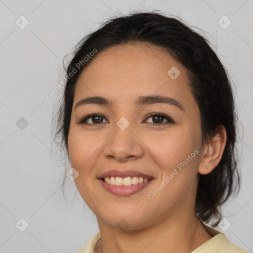 Joyful latino young-adult female with medium  brown hair and brown eyes