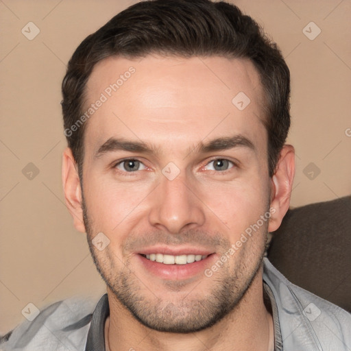 Joyful white adult male with short  brown hair and brown eyes