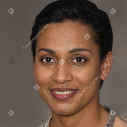 Joyful black young-adult female with short  brown hair and brown eyes