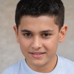 Joyful white child male with short  brown hair and brown eyes