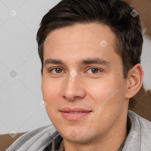 Joyful white adult male with short  brown hair and brown eyes