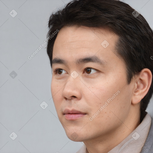 Neutral white young-adult male with short  black hair and brown eyes