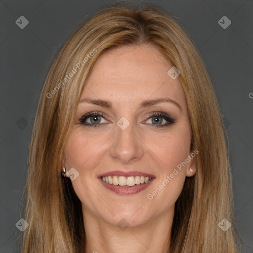 Joyful white adult female with long  brown hair and brown eyes