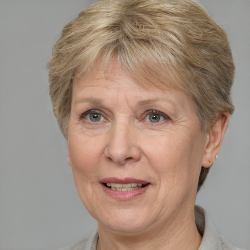 Joyful white middle-aged female with short  brown hair and brown eyes