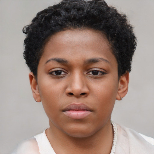 Neutral latino child female with short  brown hair and brown eyes