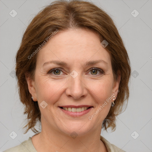 Joyful white adult female with medium  brown hair and grey eyes