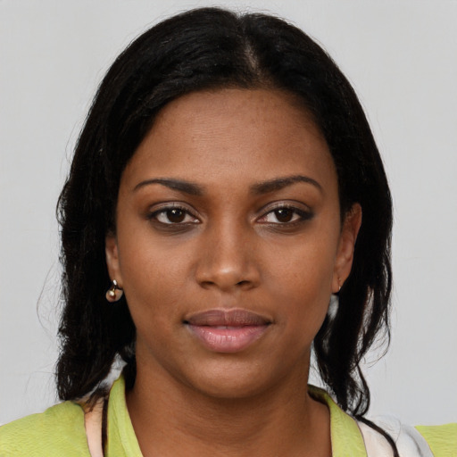 Neutral black young-adult female with medium  black hair and brown eyes