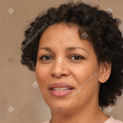 Joyful black adult female with short  brown hair and brown eyes