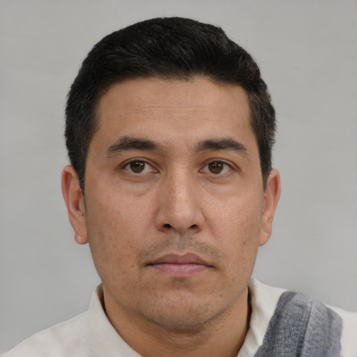 Neutral asian adult male with short  brown hair and brown eyes
