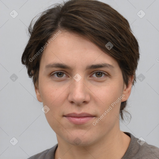 Joyful white young-adult female with short  brown hair and grey eyes