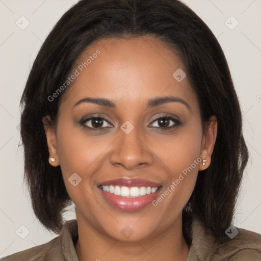 Joyful black young-adult female with long  brown hair and brown eyes